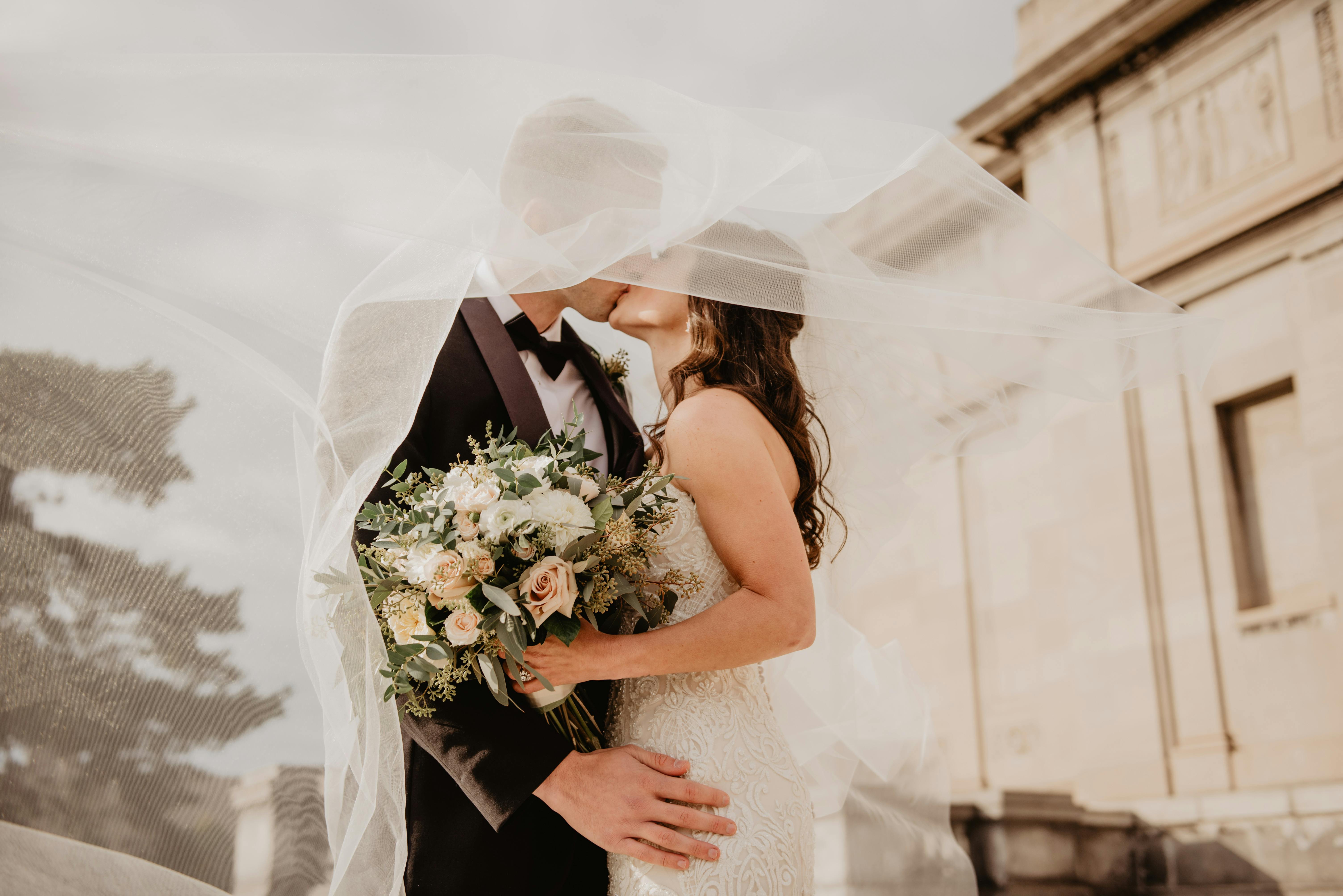Bride in wedding dress silhouette by window